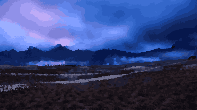 A field with a rainbow in the sky above it, surrounded by trees and hills, pixel art