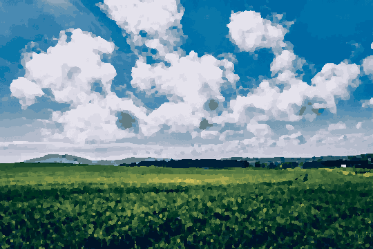 A lush green field of barley with rolling hills in the background and a bright blue sky dotted with white clouds, pixel art