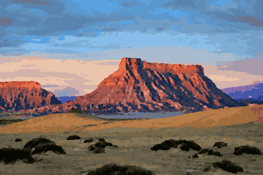 A desert landscape with a mountain in the background, illuminated by the setting sun, pixel art
