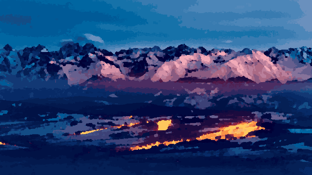 An aerial view of a city at night with snow-capped mountains in the background, pixel art