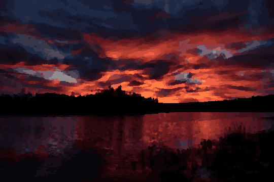 A beautiful sunset over a lake with trees in the background, pixel art