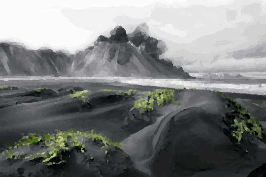 A stunning black sand beach in Iceland, with lush green grass in the foreground and majestic mountains in the background, pixel art