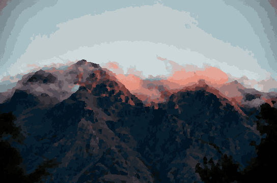 A majestic mountain range with a pink sky in the background, shrouded in a thick layer of fog, pixel art