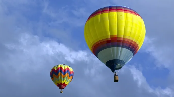 Colorful Hot Air Balloons Against White Clouds wallpapers