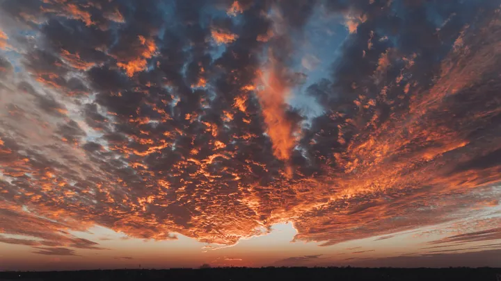 Sunset Sky With Smoke Plume And Silhouetted Trees wallpapers