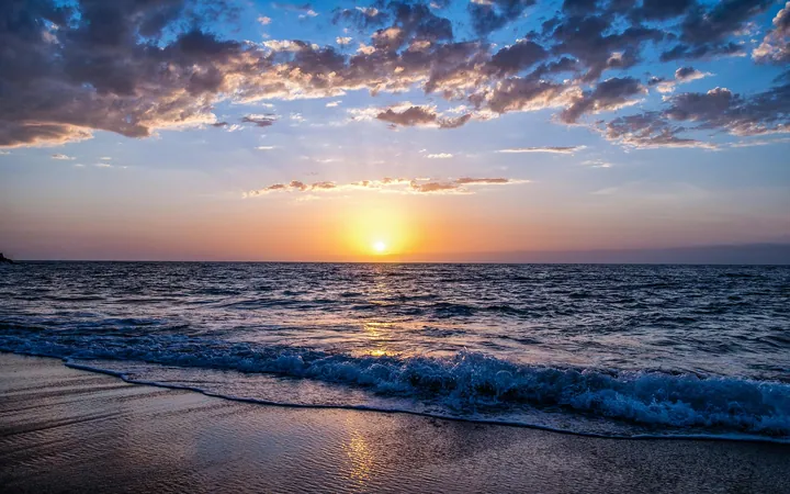 Sunset Glow Over Ocean With Clouds wallpapers