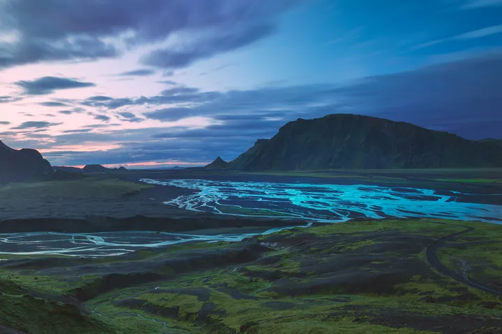 Sunlit River Flowing Through Green Valley — original wallpaper