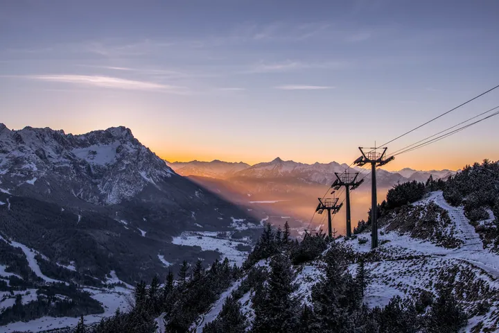 Cableway Pillars Against Snowy Mountain Sunrise — original wallpaper