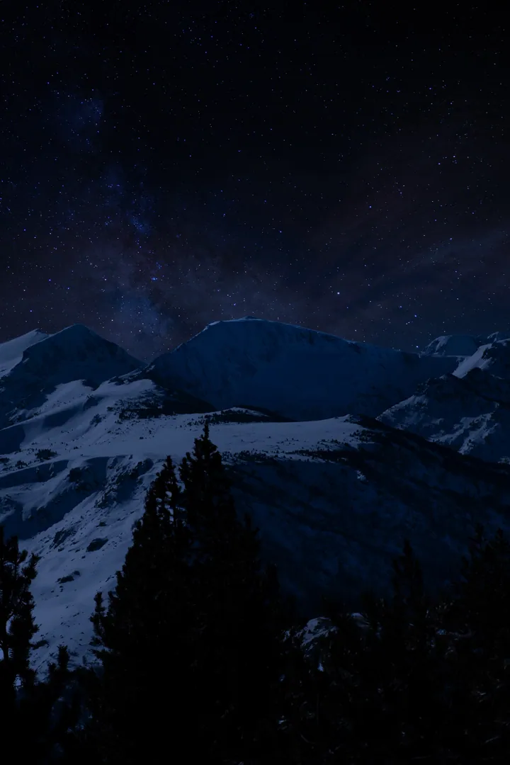 Snowy Mountain Peaks Under Starry Night Sky wallpapers