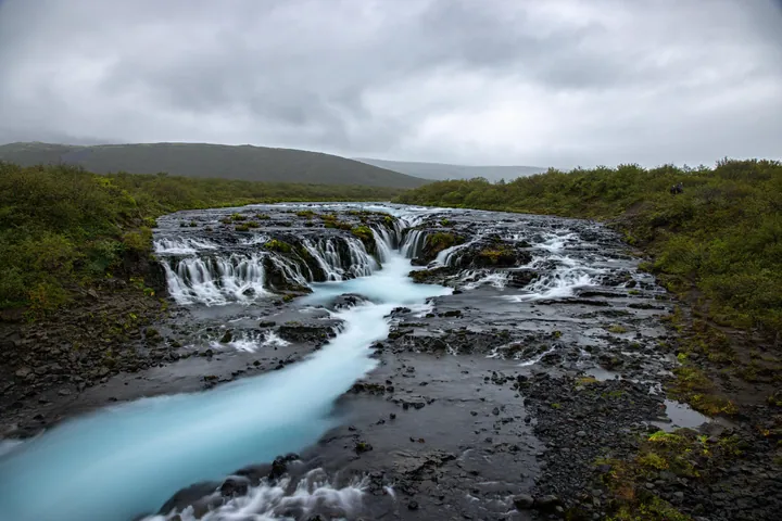 Bruarfoss Waterfall Cascading Down Rocky Cliff wallpapers