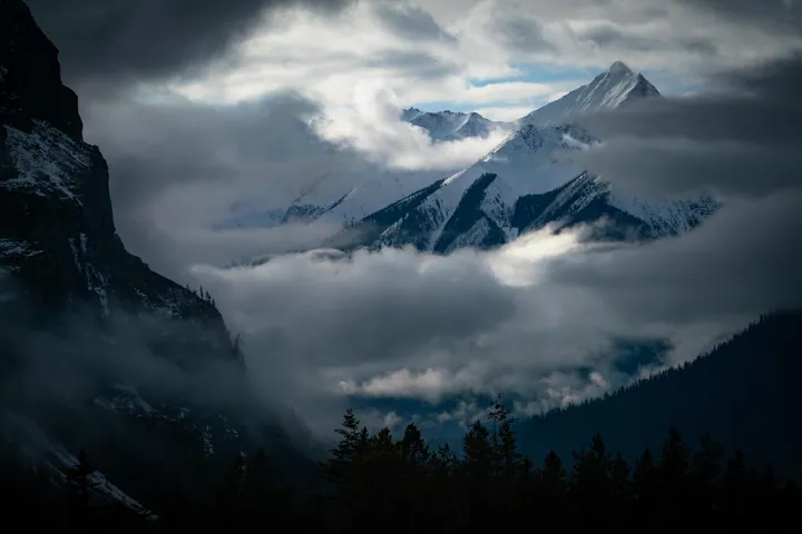 Foggy Mountain Range With Snow Caps wallpapers