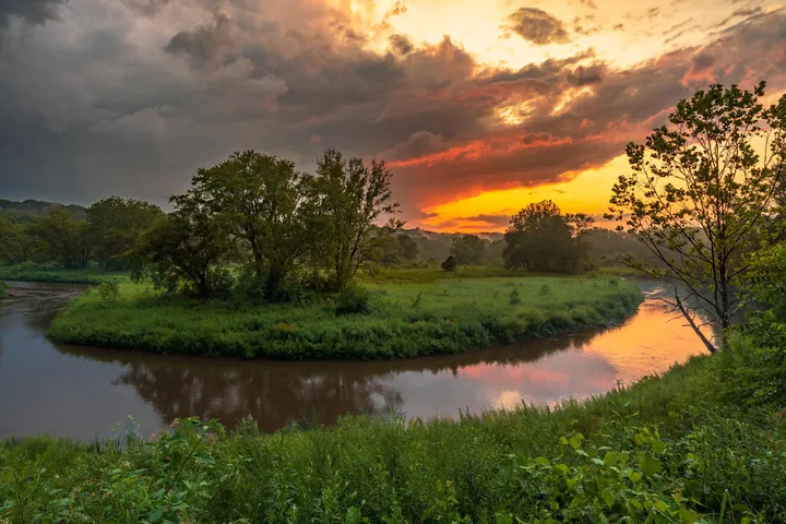 Cuyahoga River Sunset Over Lush Green Fields — original wallpaper
