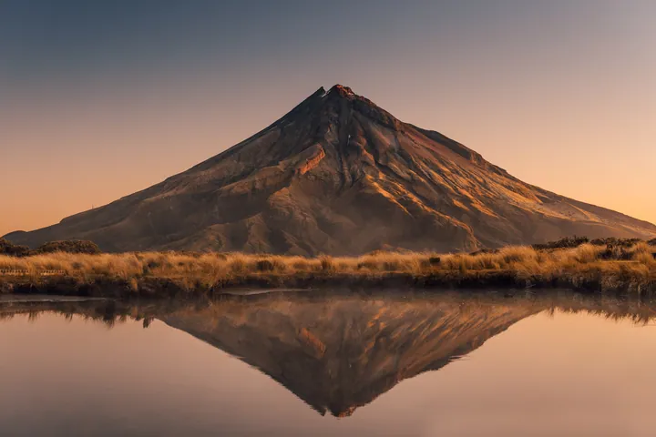 Volcano Peak Reflection On Calm Lake wallpapers