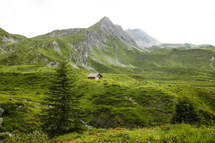 Hut In Green Valley With Blue Sky wallpapers