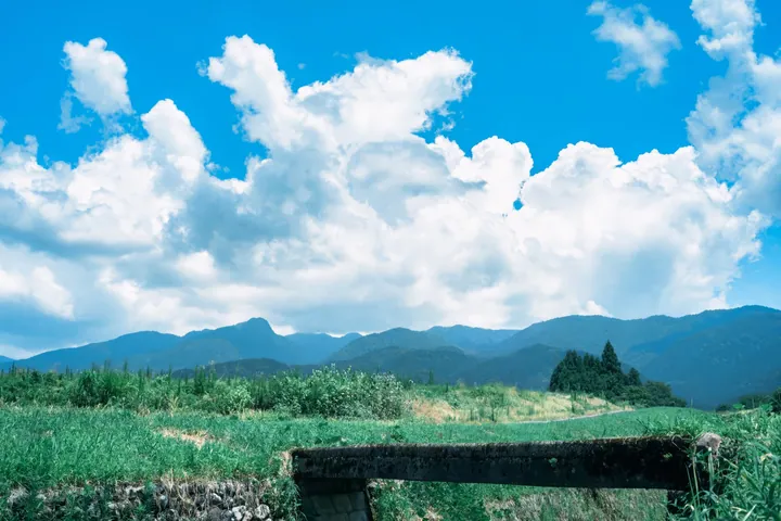 Wooden Fence Amidst Lush Green Mountains — original wallpaper