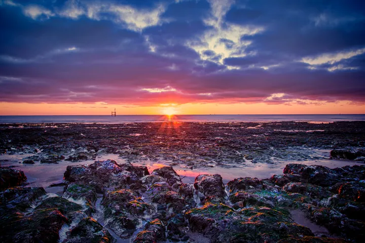 Sunset Over Ocean With Foreground Rocks wallpapers
