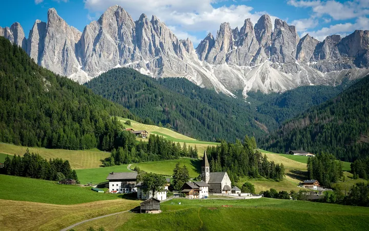Dolomites Village Nestled In Lush Green Field — original wallpaper