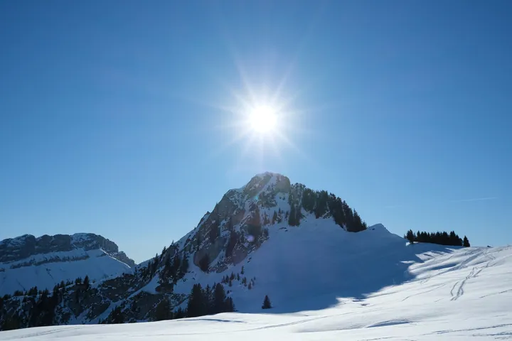 Snow-Covered Mountain With Trees And Sun — original wallpaper