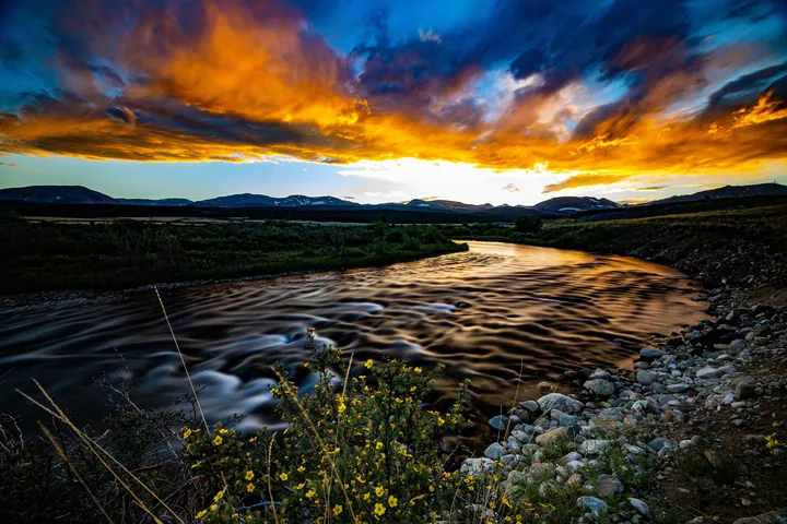 River Field Sunset With Silhouetted Hills — original wallpaper