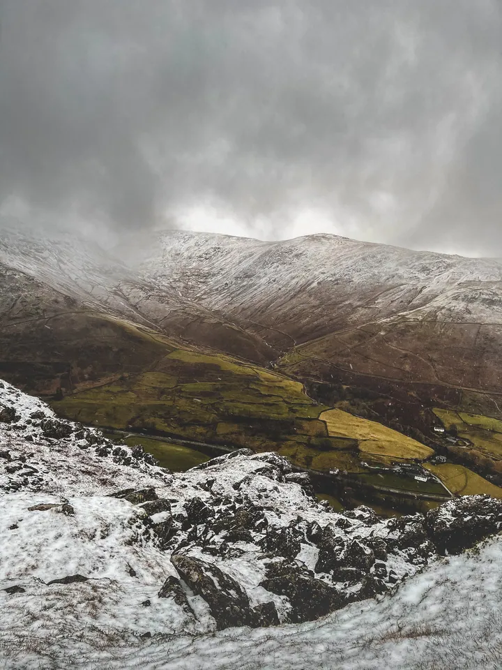 Silver Charcoal Mountain Range Amidst Fluffy Clouds wallpapers