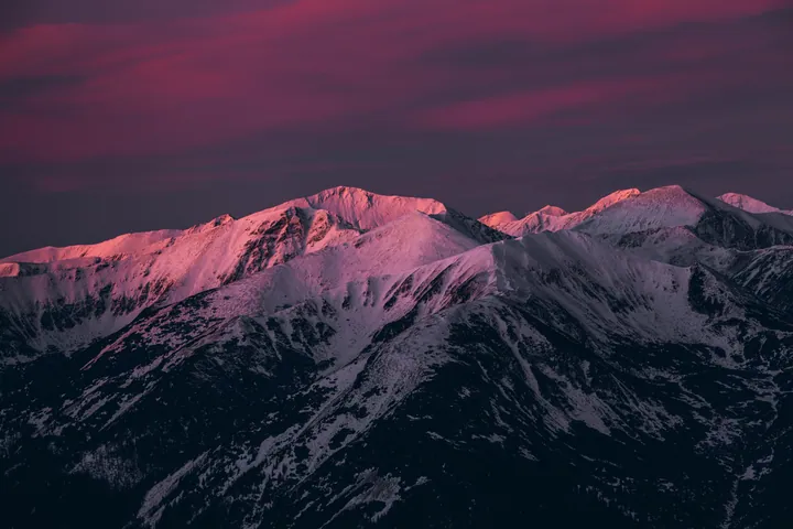 Snow-Capped Mountains Under Pink Twilight Sky wallpapers